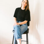 Photo of Stefanie O'Neill owner of November Made in black shirt and jeans.