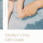 Photo of mom in blue dress holding baby with caption: Mother's Day Gift Guide by Shanna Skidmore