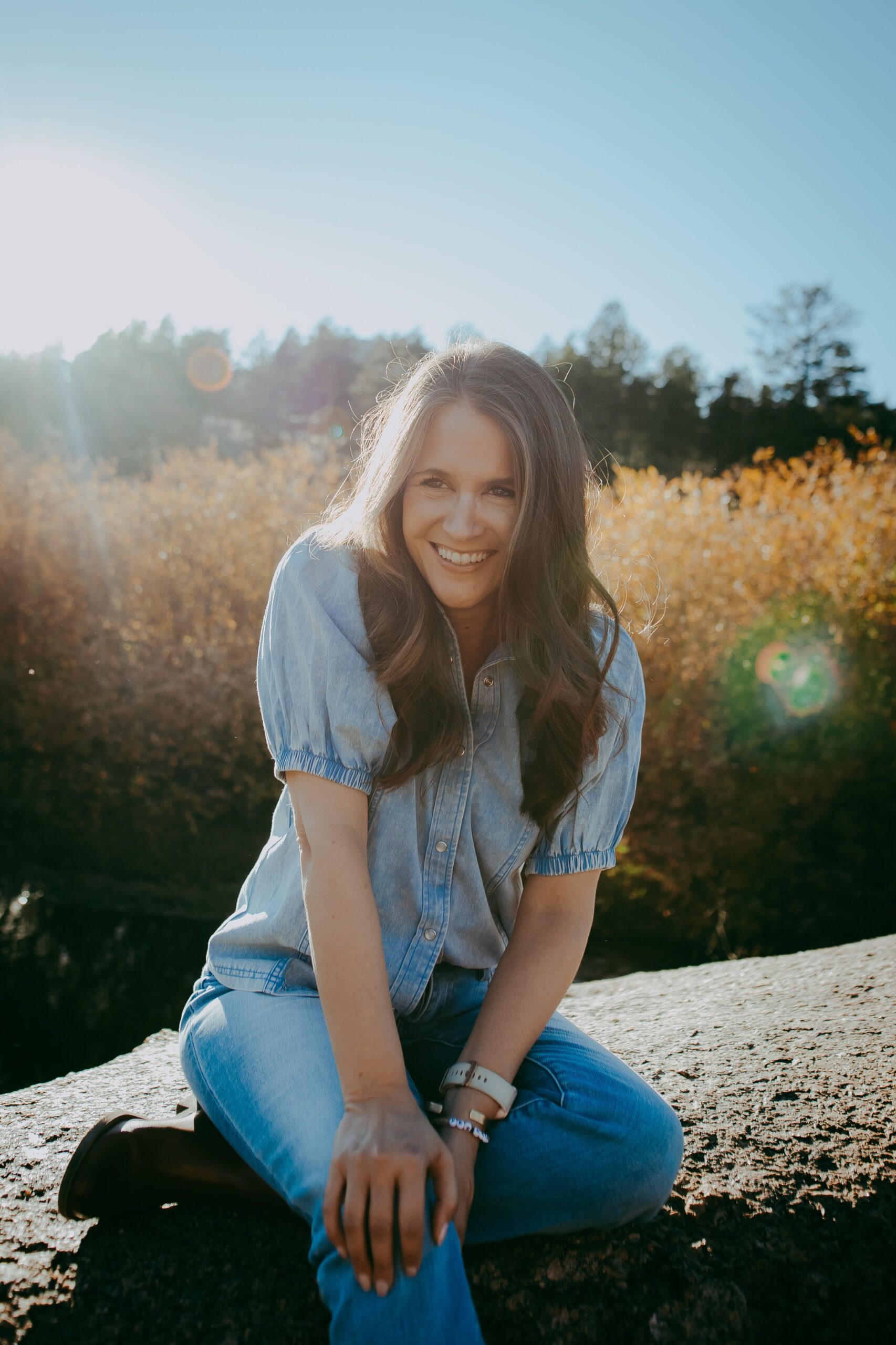 Photo of Jenn Jett Barrett Founder of The Well Summit in blue shirt