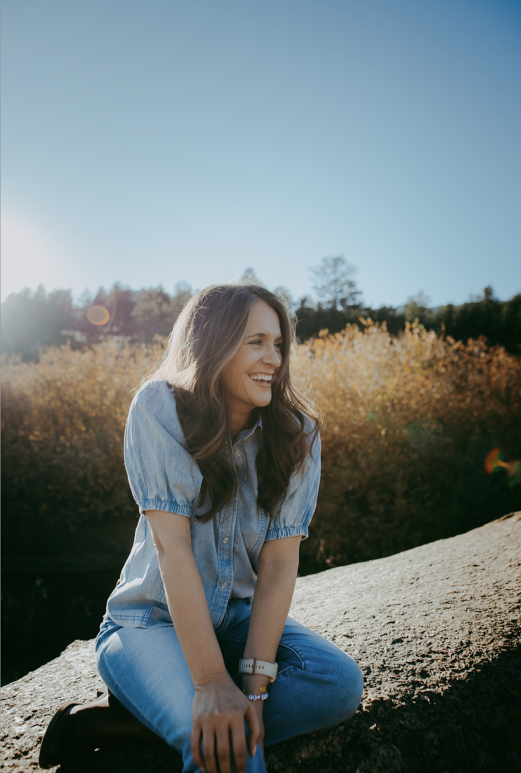 Photo of Jenn Jett Barrett Founder of The Well Summit in blue shirt